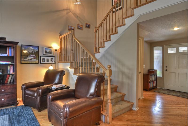 Ascend the Dramatic Custom Wood Staircase & Banister to the Upstairs Bedrooms