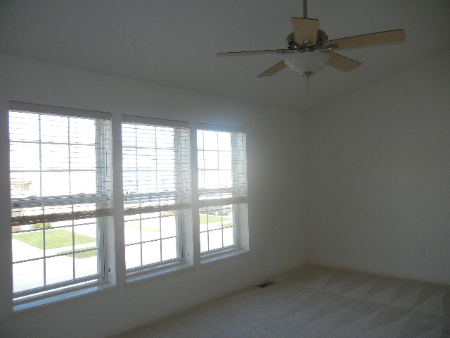 master suite with vaulted ceiling, large walk in closet, and private bath