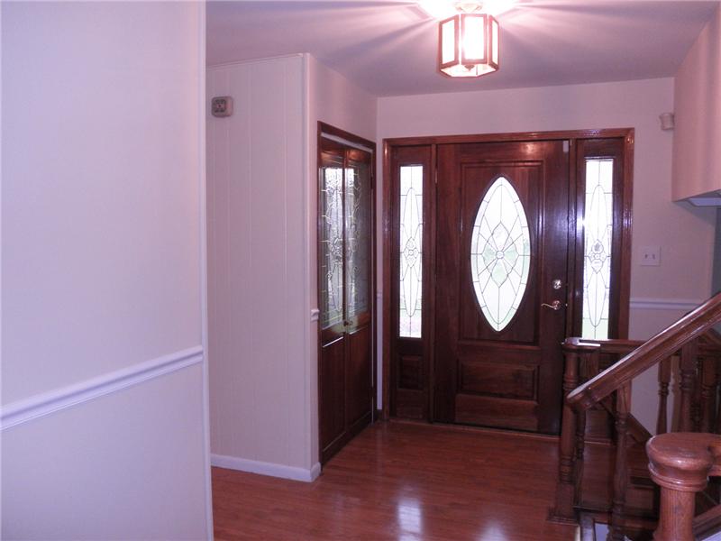 Entry foyer with wood floors