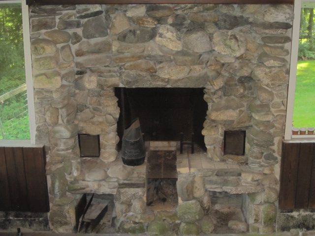 Fireplace on lower level of screened-in porch