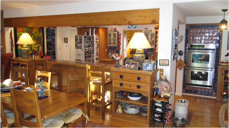 Gourmet kitchen with stainless steel appliances and custom features