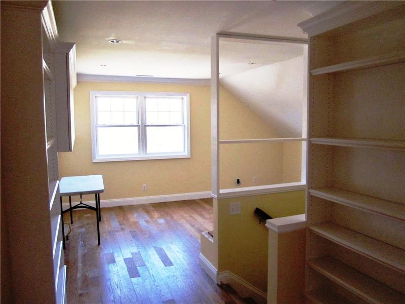 Bonus room above garage with hardwood floors