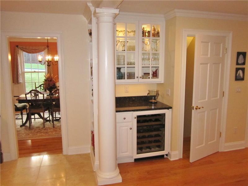 Built-in cabinets and wine refrigerator in breakfast room