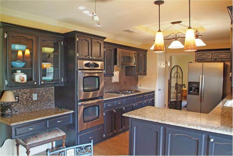 Gorgeous cabinets, exotic granite, updated lighting
