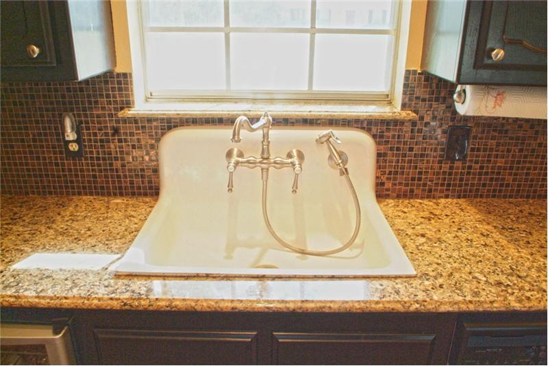 Antique 1909 sink and granite on the window sills!
